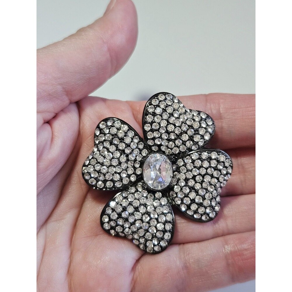 Dark silver tone rhinestone flower brooch